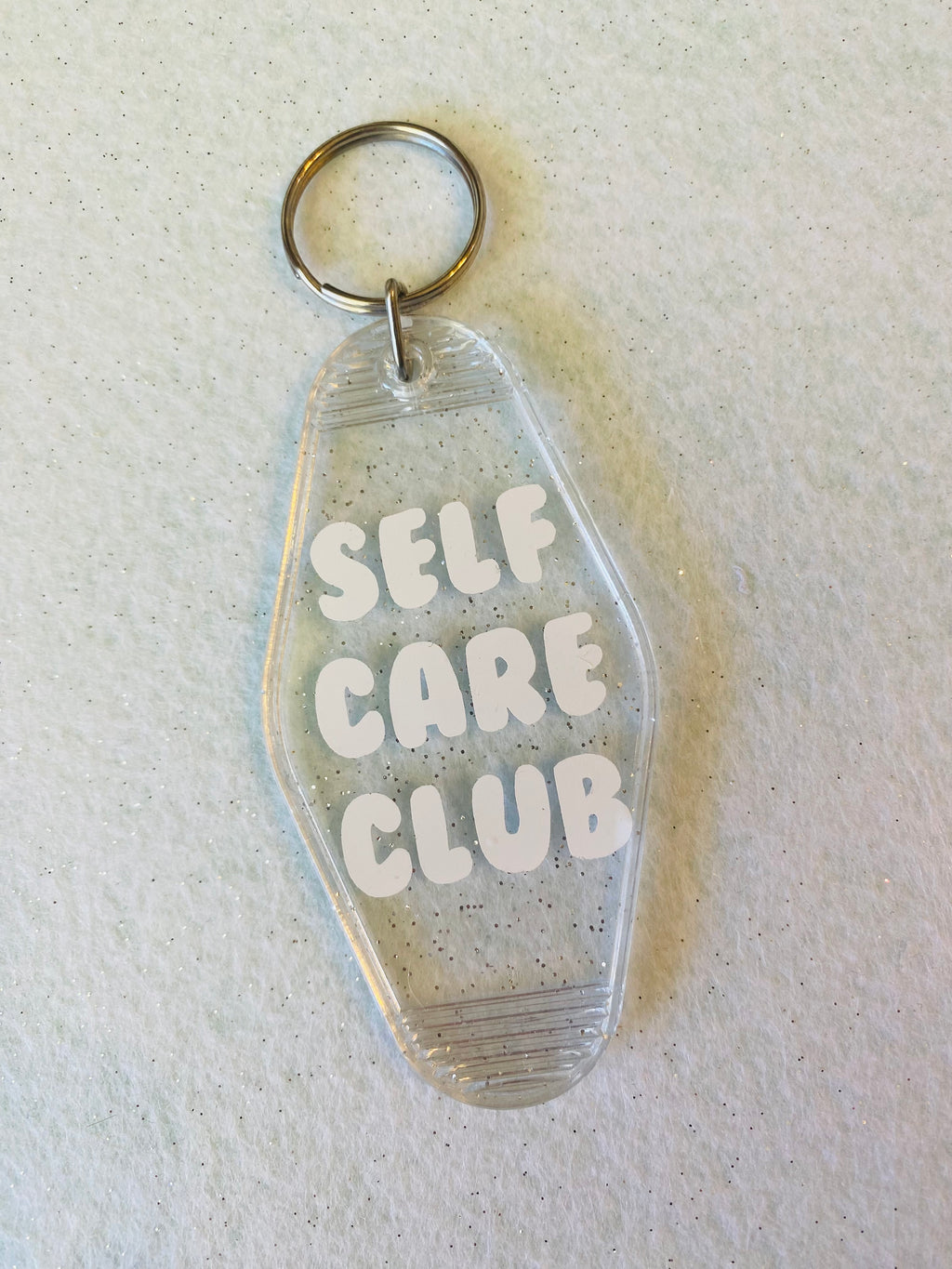 Self Care Club Clear Glitter Acrylic Motel Keychain
