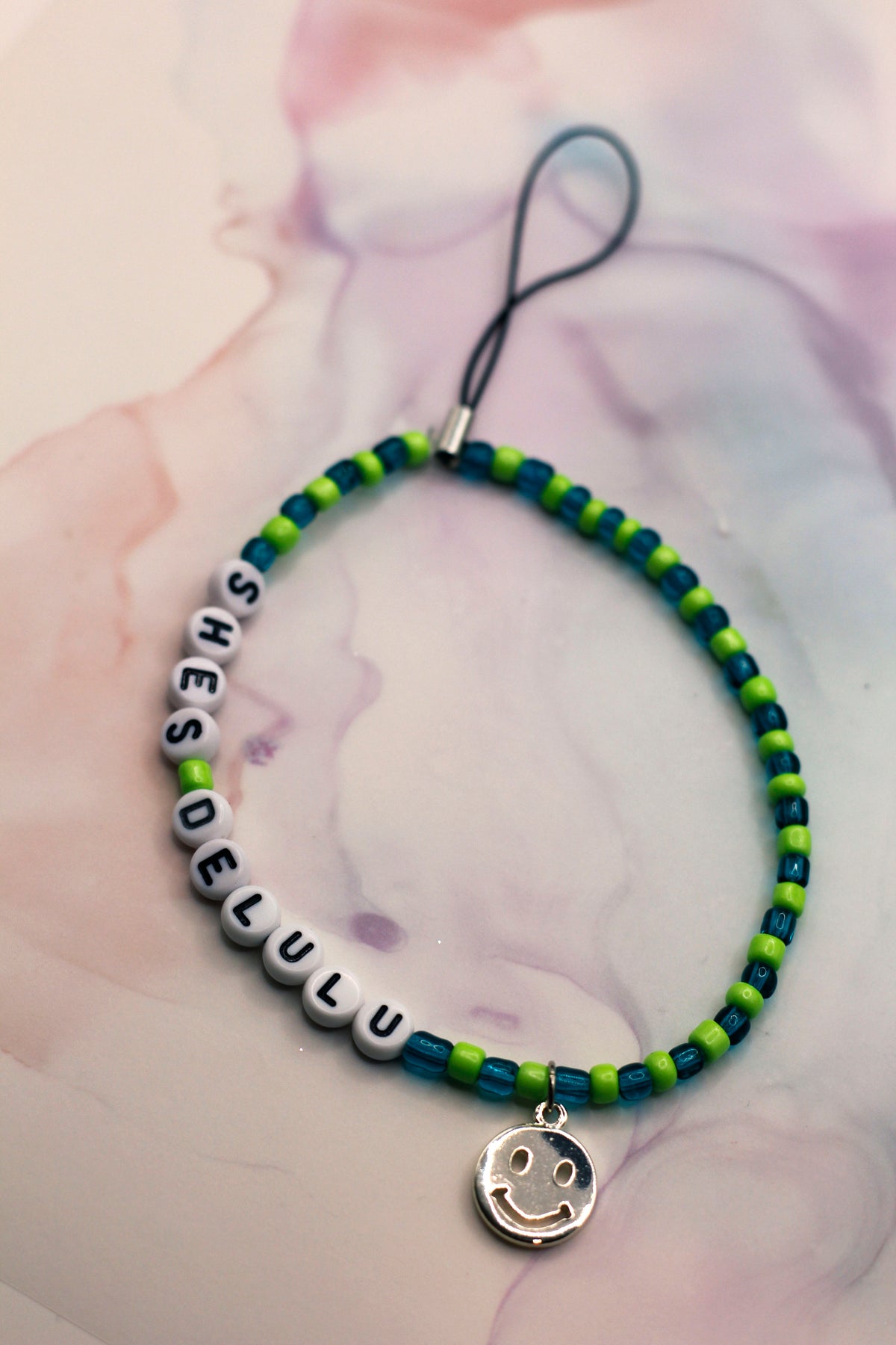 She's Delulu Teal and Green Phone Charm