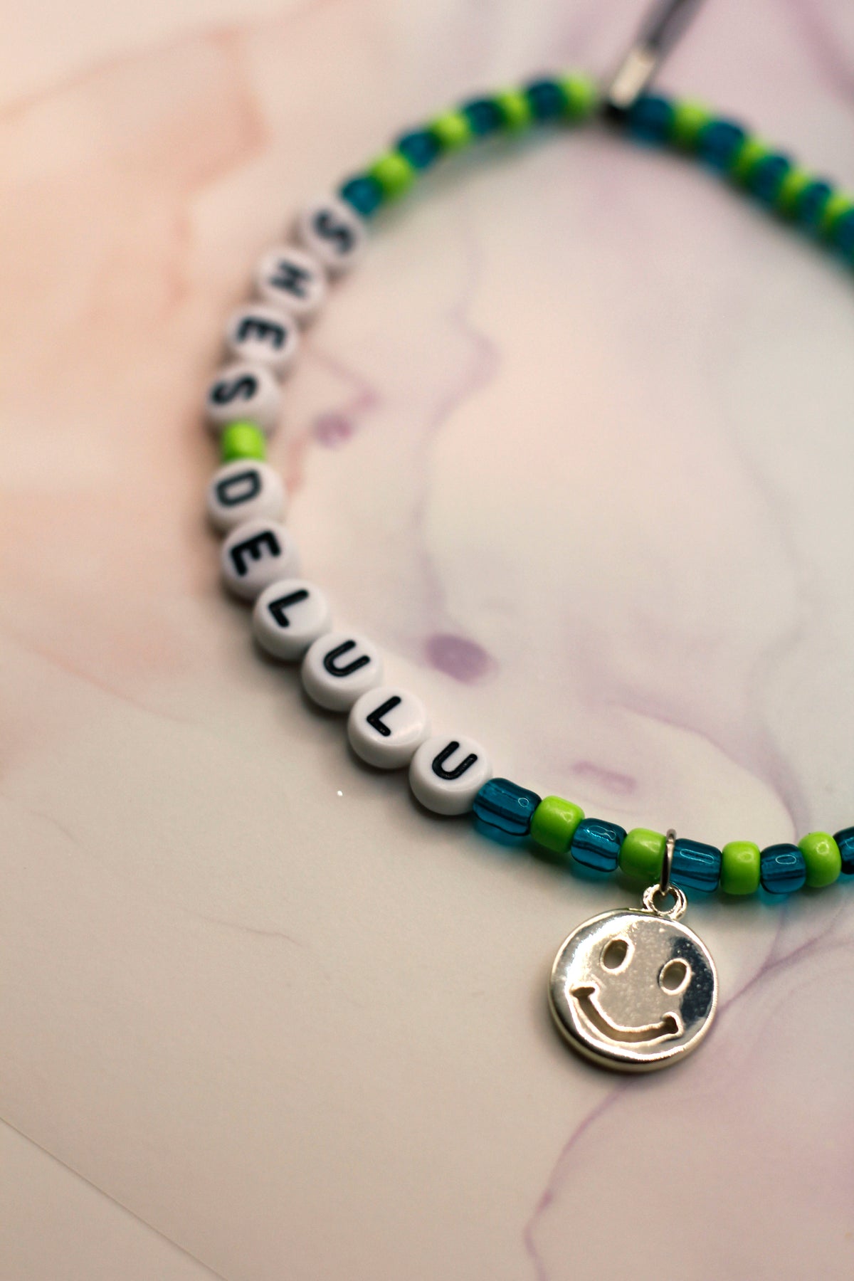 She's Delulu Teal and Green Phone Charm